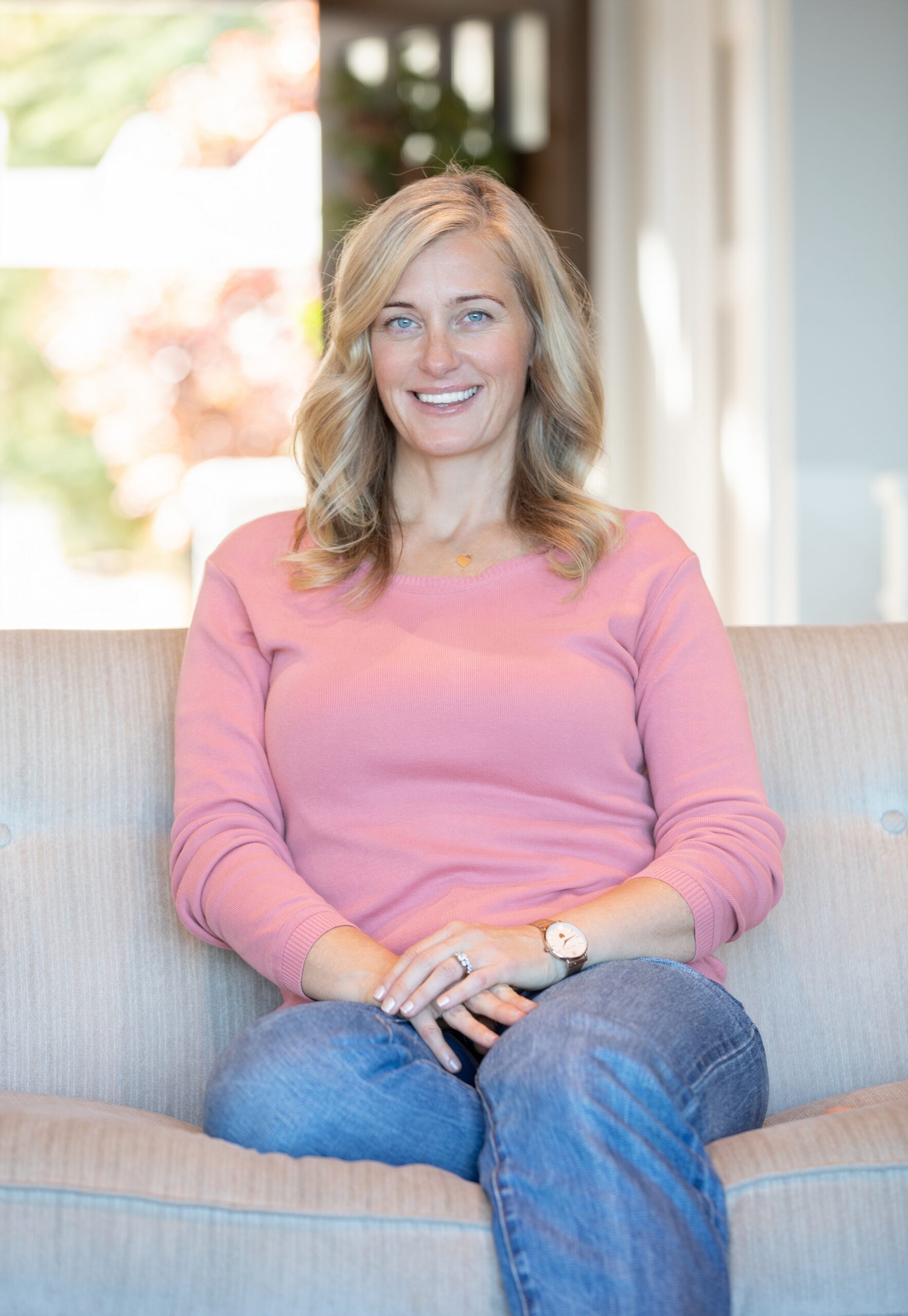Picture of Author Emily Madill in pink shirt