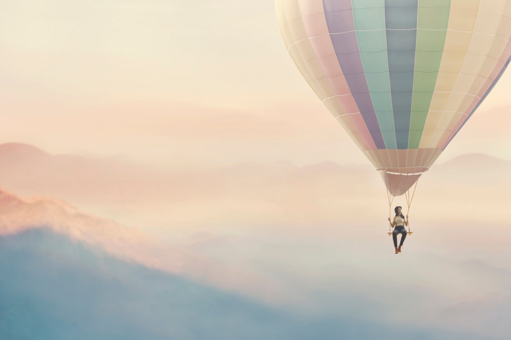 The Art of Detachment, Let it Go, Letting Go concept woman in hot air balloon